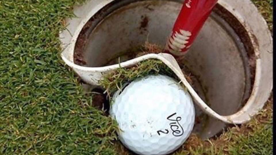 Ball embedded in the lip of the hole - what's the ruling? 