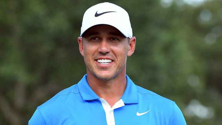 WATCH: Little kid hilariously examines Brooks Koepka's golf swing