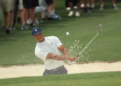 Tiger Woods shows off his strange but very effective bunker drill