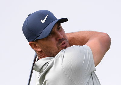 Brooks Koepka HOBBLES up the steps ahead of the US Open!