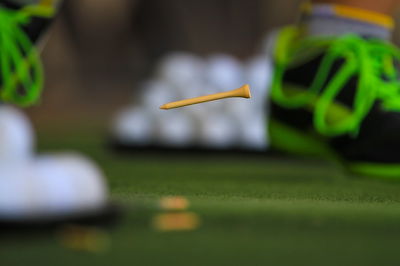 Golfer caught TEEING HIS BALL in the rough during competition