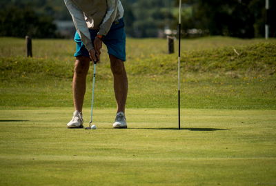 Golfer CHANGES FLAG LOCATION to leave tap-in birdie