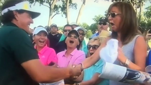 Phil Mickelson signs autograph for lady, and she absolutely loves it! 