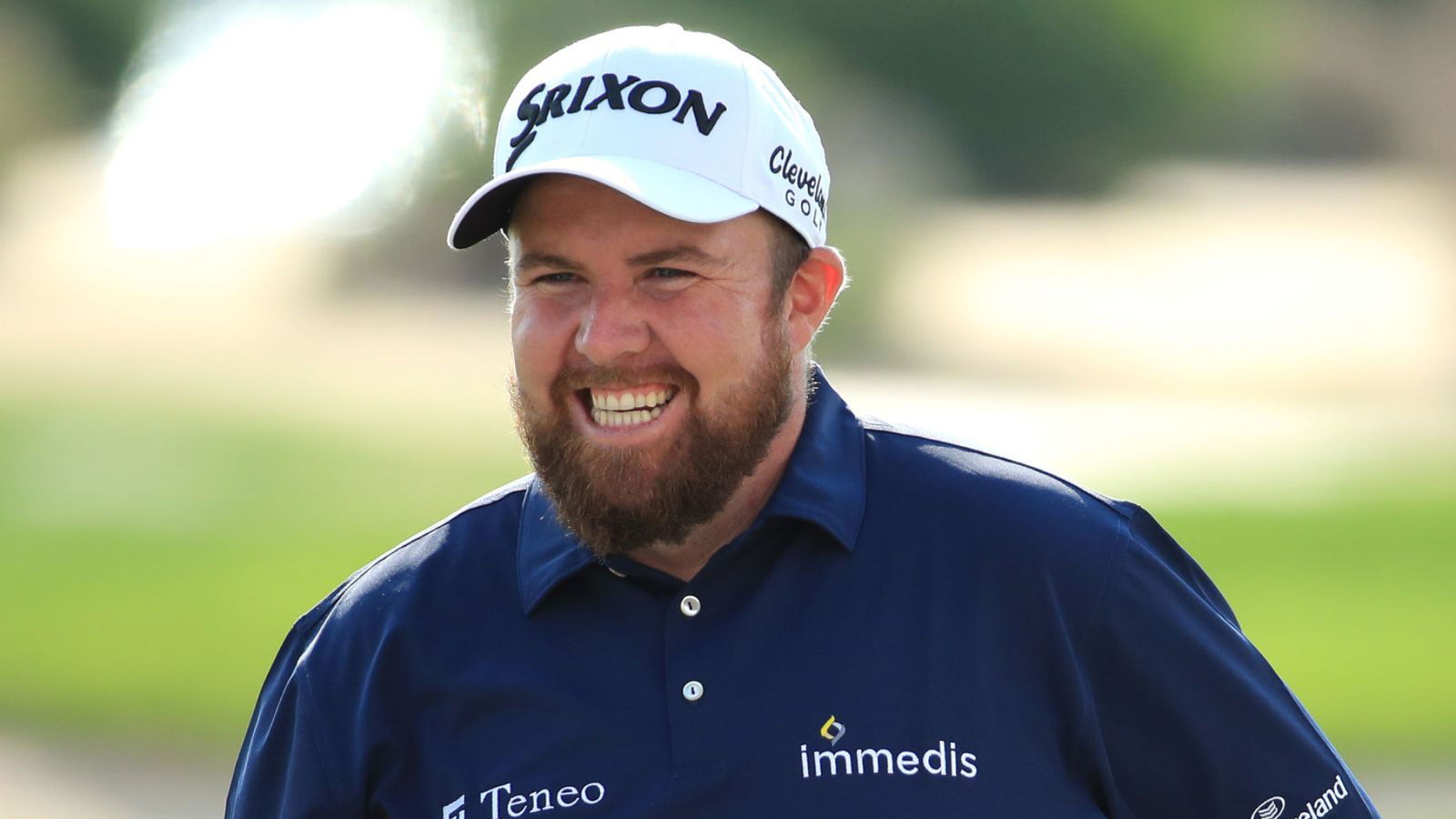 Shane Lowry hits golf shot through a giant bush at Saudi International