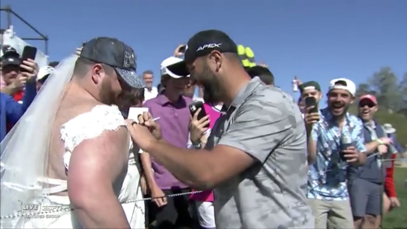 WATCH: Jon Rahm makes birdie then signs the dress of a bride at Phoenix Open!