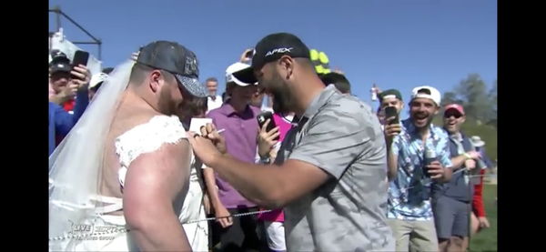 WATCH: Jon Rahm makes birdie then signs the dress of a bride at Phoenix Open!