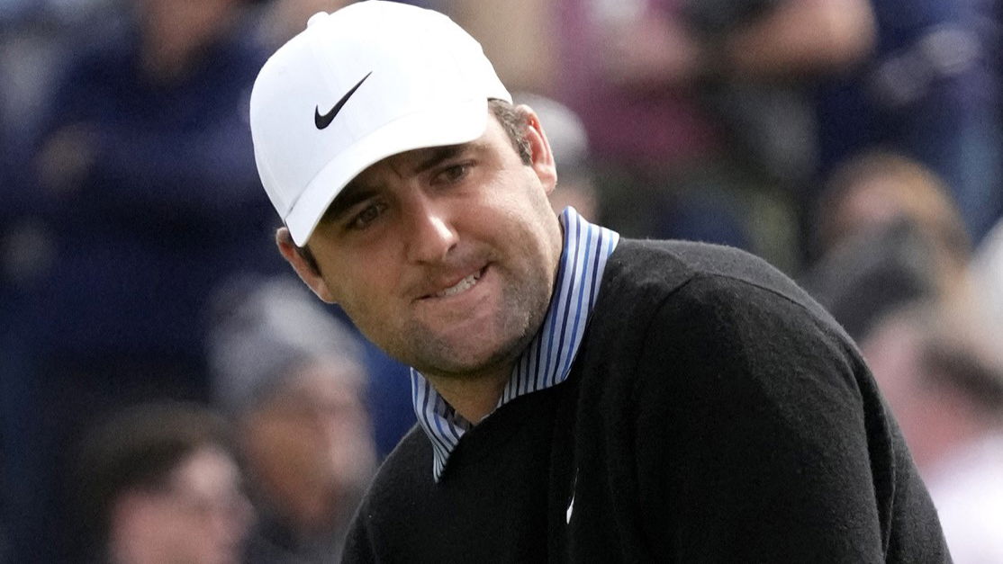 Scottie Scheffler putts golf ball into bunker at WM Phoenix Open