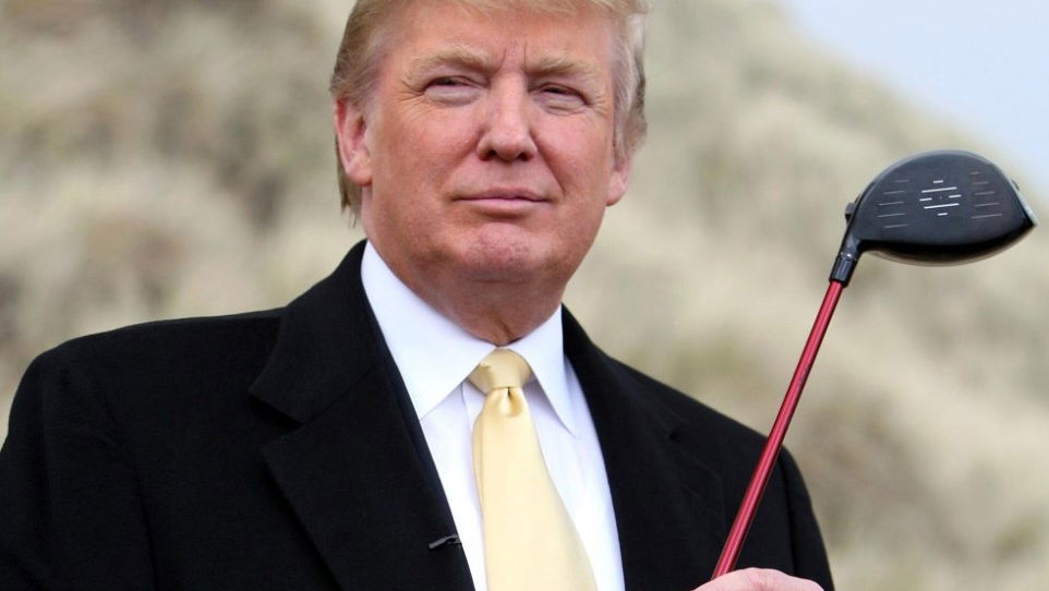 Donald Trump makes caddie hang on to back of golf cart!