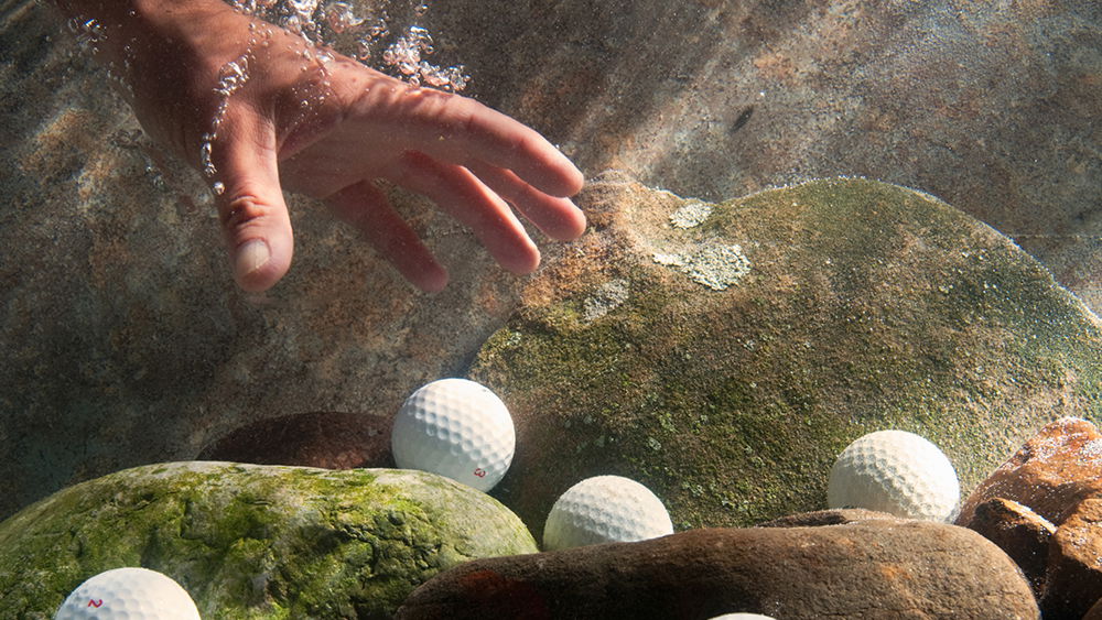 college golfer drops ball in hazard dives in to find it