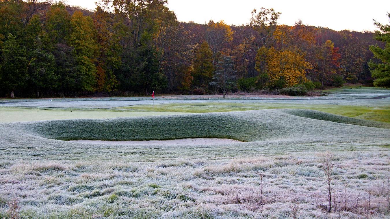 Why do some golf clubs use temporary greens, while others don't?