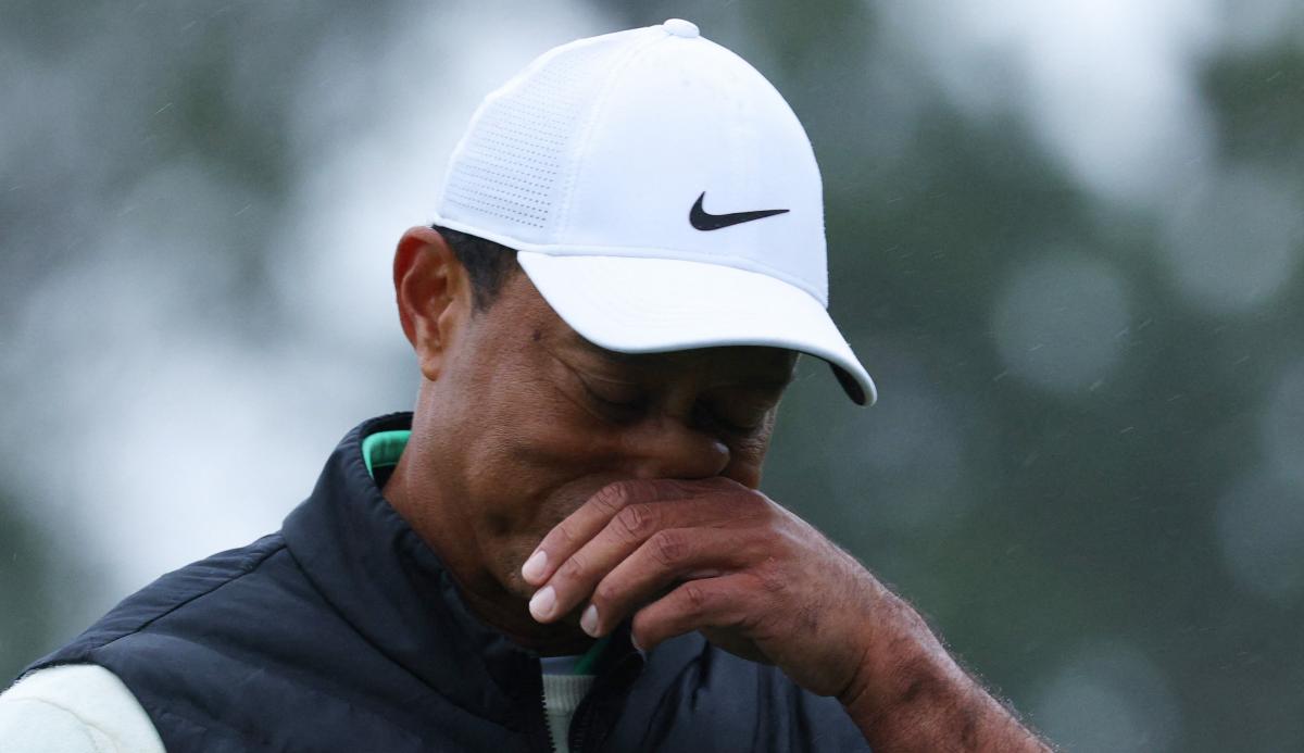 Tiger Woods looks down and out as he hobbles to LAST place at The Masters