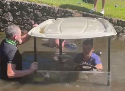 WATCH: Golf trip off to shocking start after golf cart finds the water!