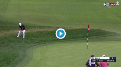 Patrick Reed snaps his wedge in frustration
