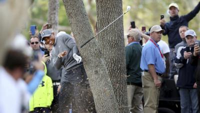 WATCH: Tiger Woods smashes club into tree, opens with 70