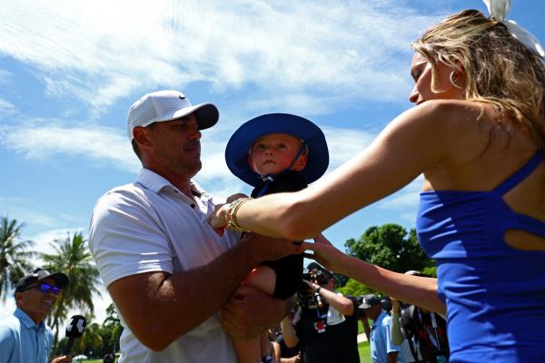 Brooks Koepka with his son and wife Jena 