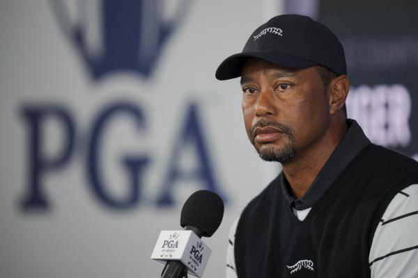 Tiger Woods speaks to reporters before the 2024 US PGA