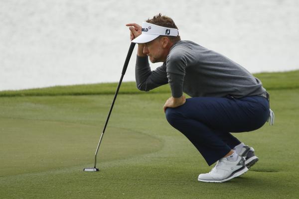 Ian Poulter shares the lead as McIlroy struggles