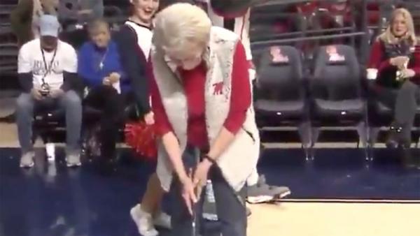 Old lady wins car after holing 94-foot putt at basketball game
