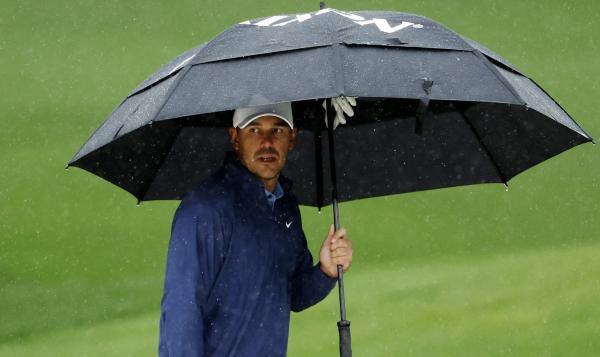 Brooks Koepka extends Masters lead as third round is suspended by weather