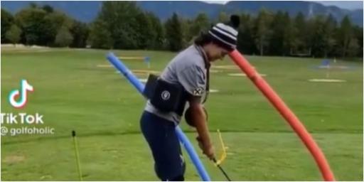 Paralysis by analysis: Amateur golfer goes a bit OVER THE TOP with training aids