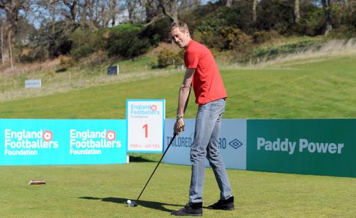 Why is the giant Peter Crouch using such small golf clubs?