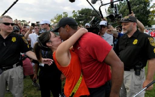 Tiger Woods shares embrace with Erica Herman and fellow Tour pros