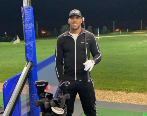 Social media reacts as Anthony Joshua plays golf with iron head covers!