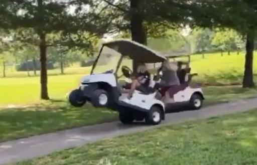 Golfers do a WHEELIE in golf cart before tipping it over