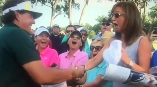 Phil Mickelson signs autograph for lady, and she absolutely loves it! 