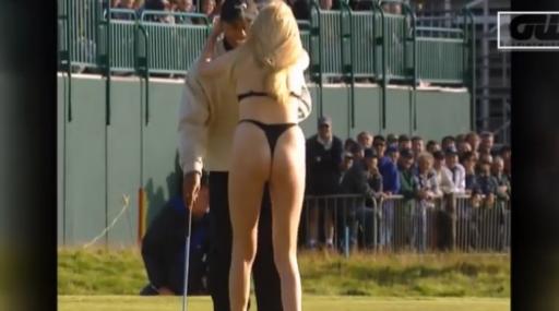 tiger woods receives kiss from streaker at the open