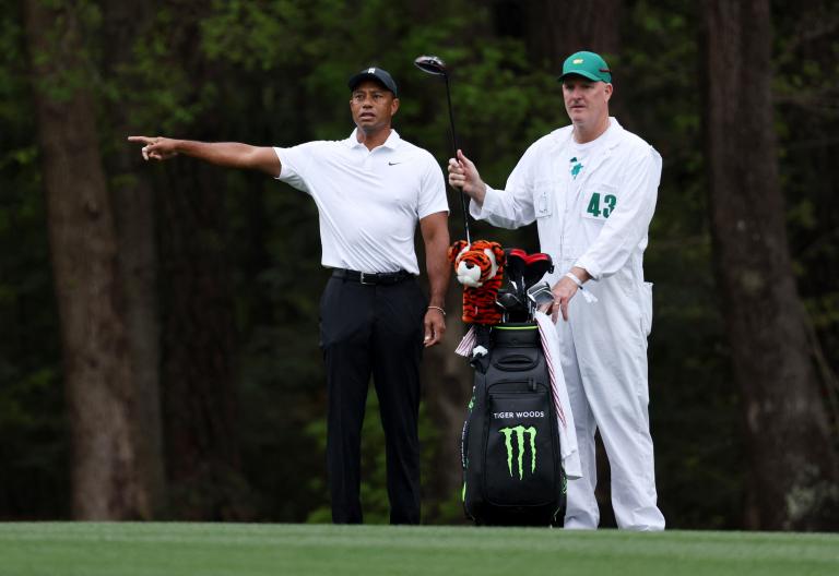 Tiger Woods shows a "noticeable limp" walking downhill but looks "locked in"