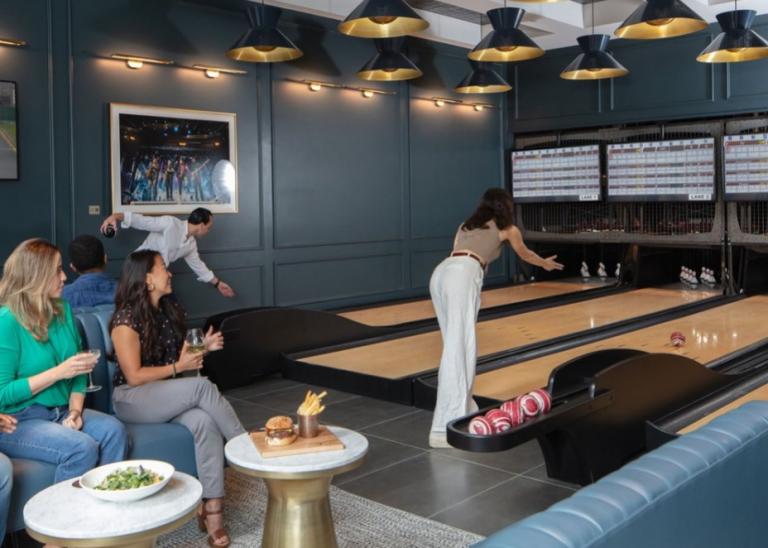 Tiger Woods and Justin Timberlake unveil sports bar and indoor golf experience