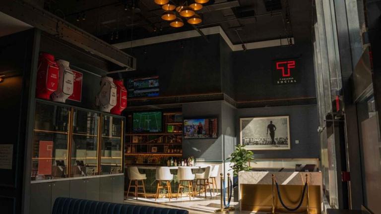 Tiger Woods and Justin Timberlake unveil sports bar and indoor golf experience