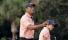 Charlie Woods looks unrecognisable as Tiger Woods returns to caddying duties