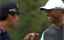 Tiger Woods and Kevin Na both run in their putts at 17 