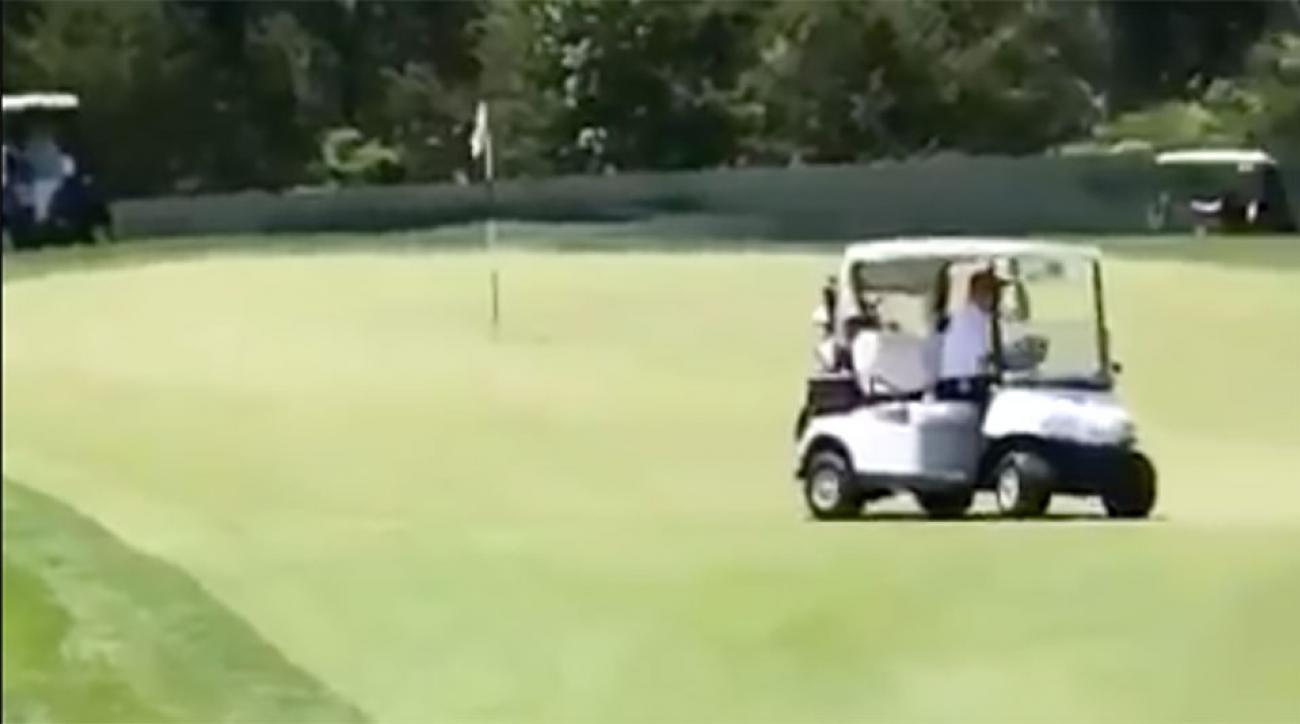Donald Trump drives buggy over green