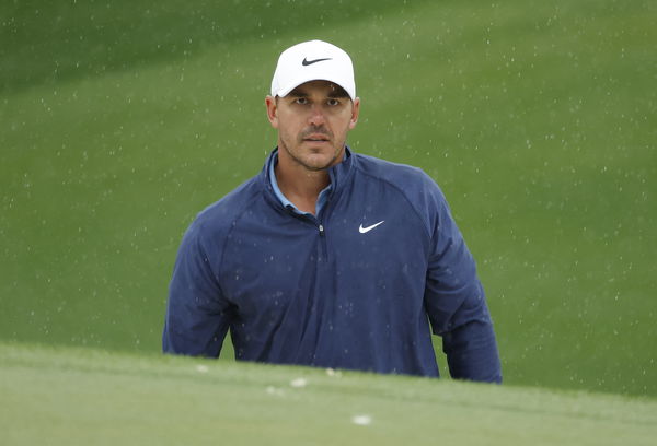 Brooks Koepka extends Masters lead as third round is suspended by weather