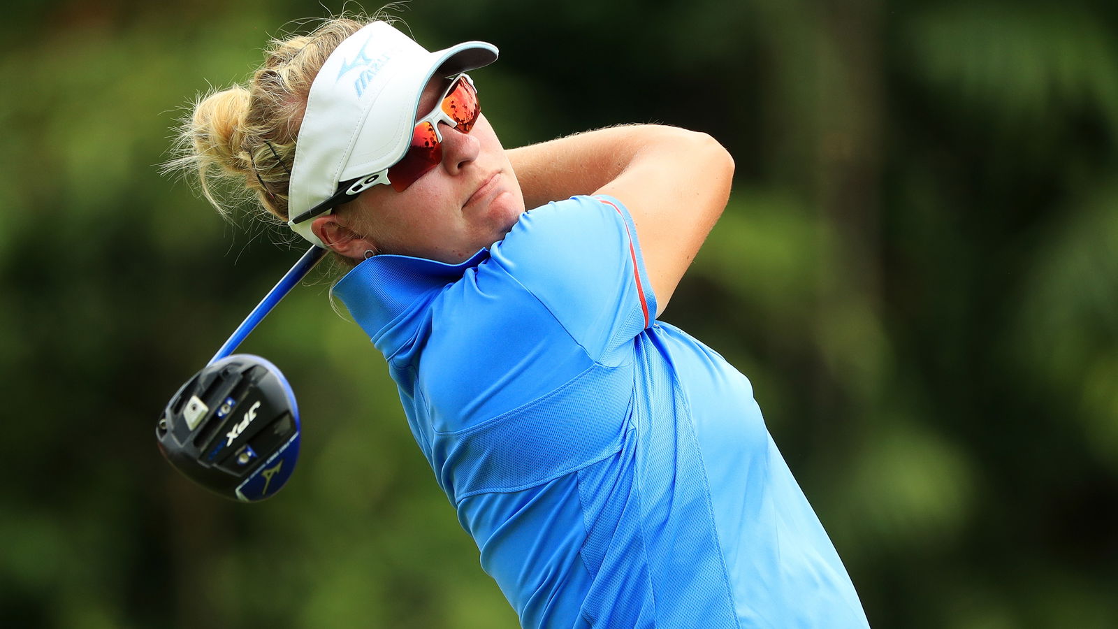 LPGA player cleared of penalty, then docked one stroke after video review