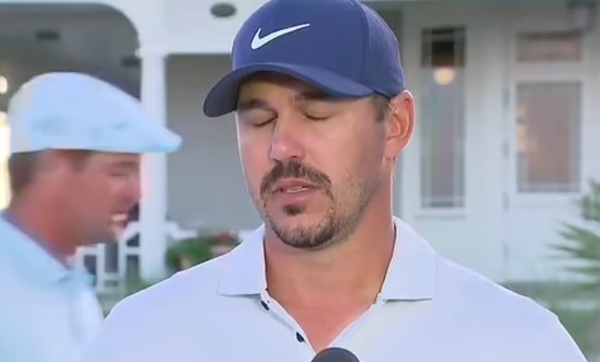 Brooks Koepka HOBBLES up the steps ahead of the US Open!