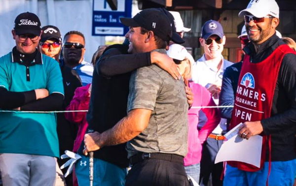 Spieth and Reed hug